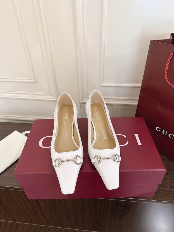 Gucci Horsebit Pointed-Toe Pumps in white leather with silver-tone hardware, displayed on red Gucci box